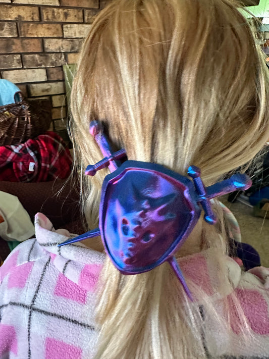 3D printed color shifting dragon sword and shield hair tie decoration.